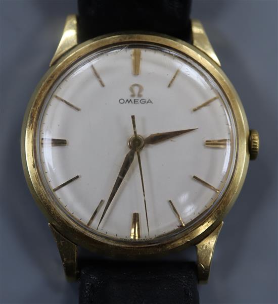 A gentlemans yellow metal Omega manual wind wrist watch, with case back inscription.